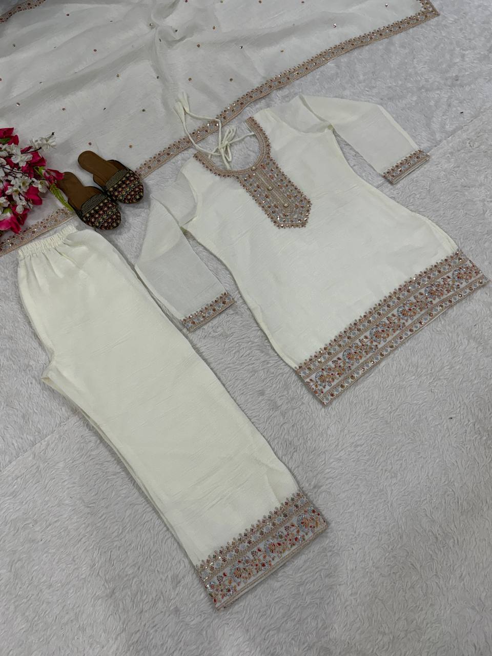 Pristine Ivory White Kurta and Palazzo Set Featuring Delicate Floral Embroidery, Sequined Borders, and a Matching Sheer Dupatta